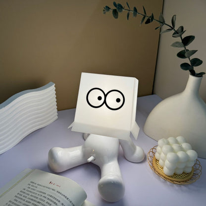 Small seated figure night light lit from within