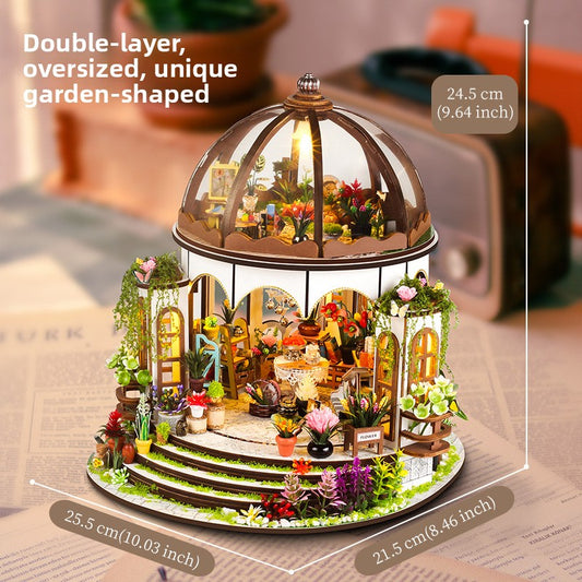 Wooden miniature house kit topped with a planted roof garden