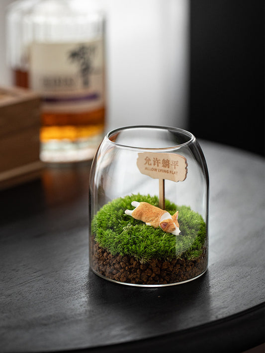 Potted moss landscape with a small corgi figure