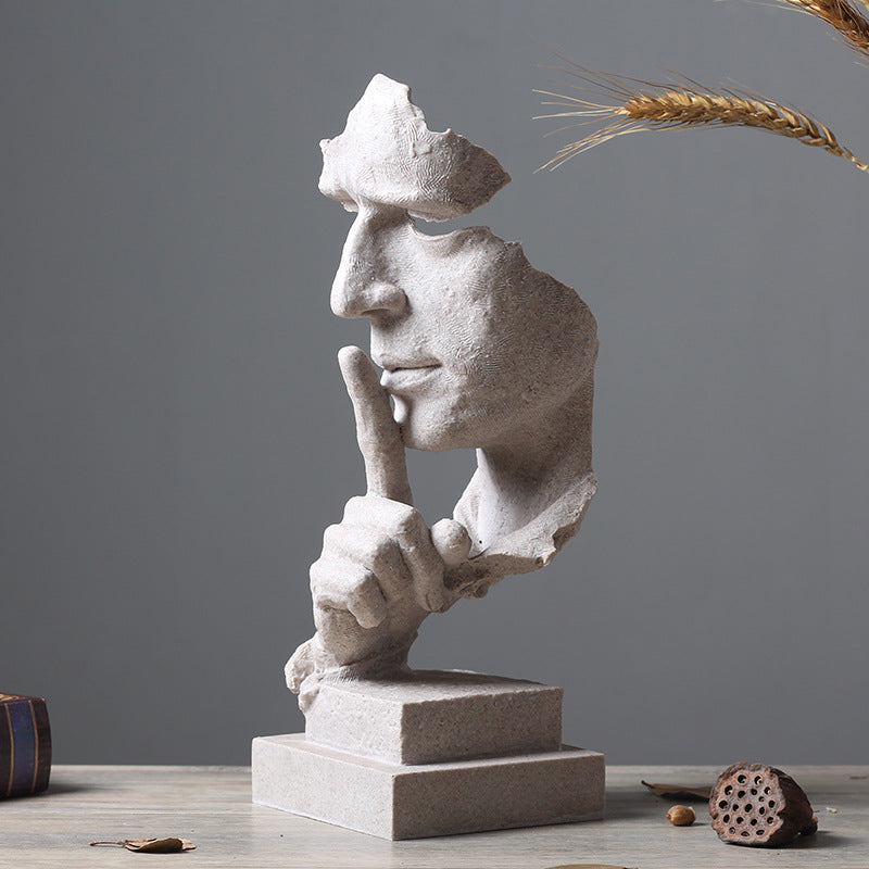Pared-back figure sculpture in cast resin, sandstone finish