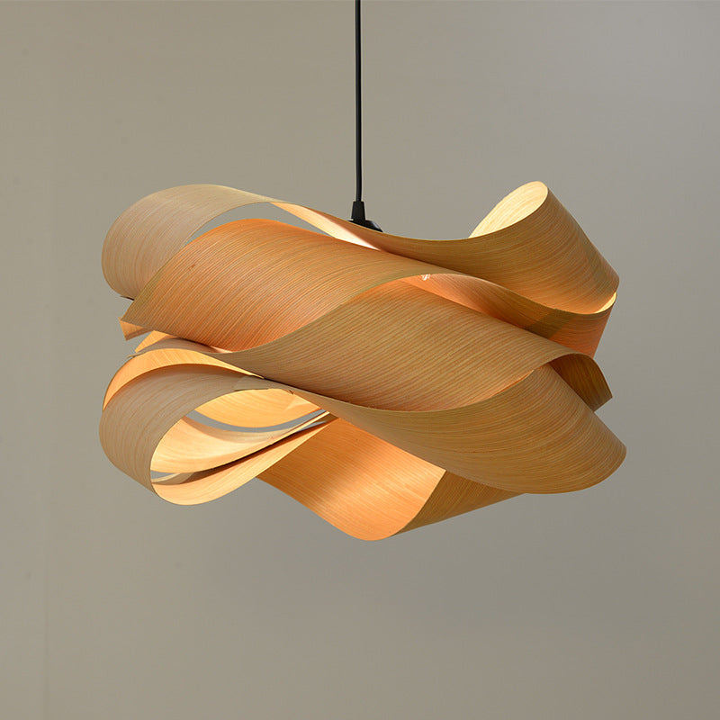 Pendant light in real wood veneer glowing warm amber