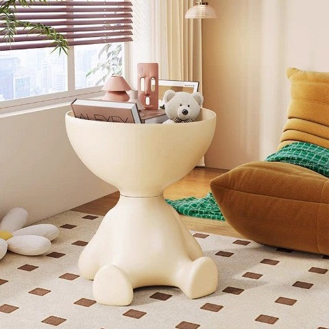 Sculptural side table shaped like a sliced head, with storage