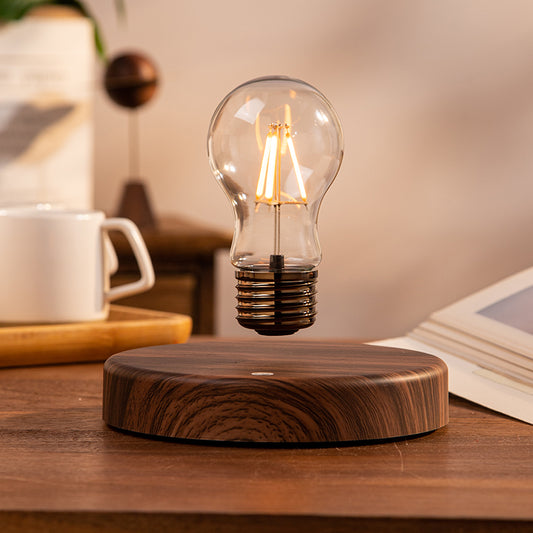 Glass bulb floating in mid-air above its magnetic base