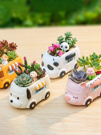 Small resin planters shaped like carts, with animal figures